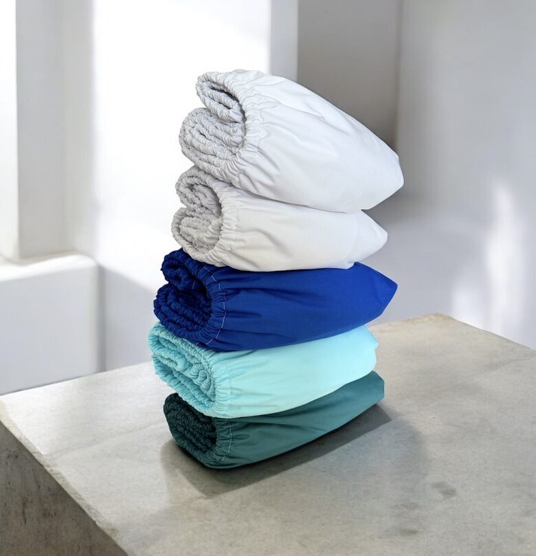 Vienkrāsaini mitrumnecaurlaidīgi palagi ar kokvilnas pārklājumu un gumiju